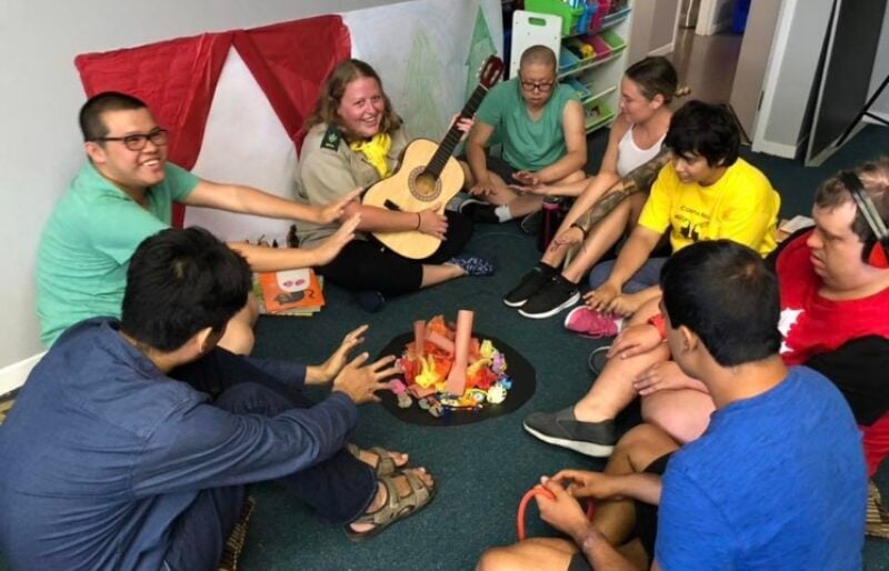 Group sitting around make believe campfire