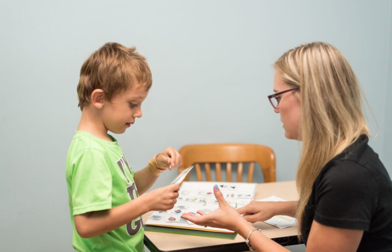 Autism instructor working with child