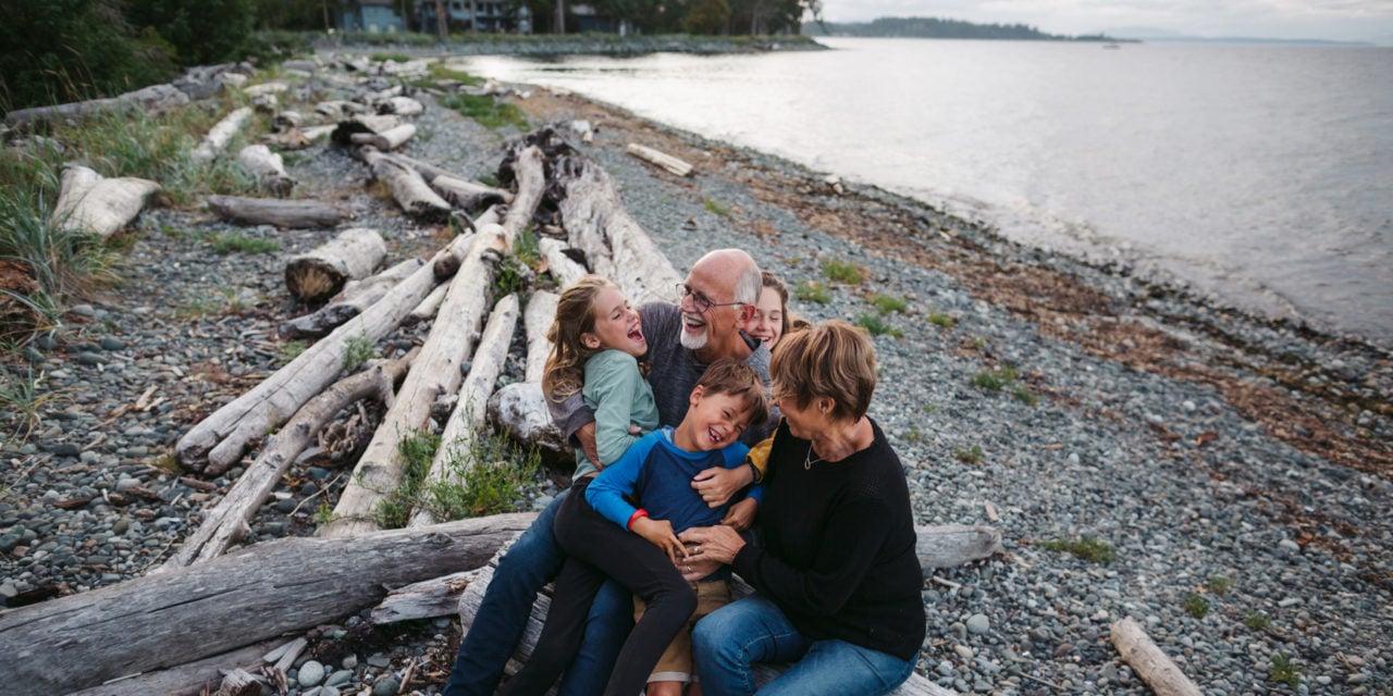 Grandparents with their grandchildren on the beach