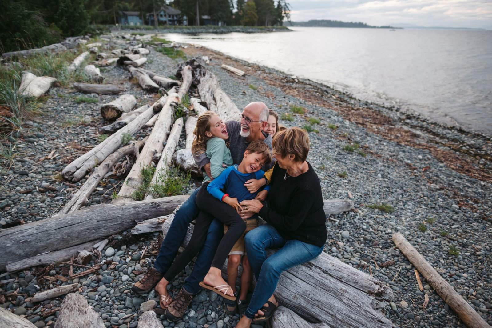 Grandparents with their grandchildren on the beach