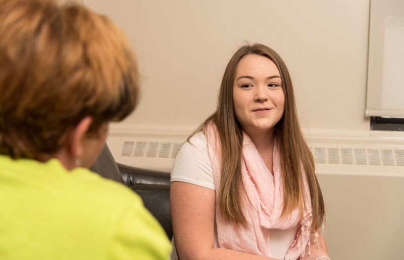 Youth listening to counsellor