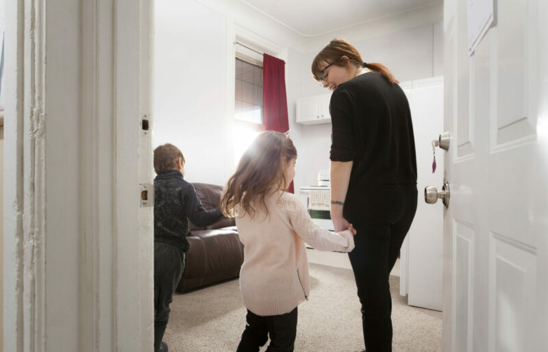 A woman in her living room her family