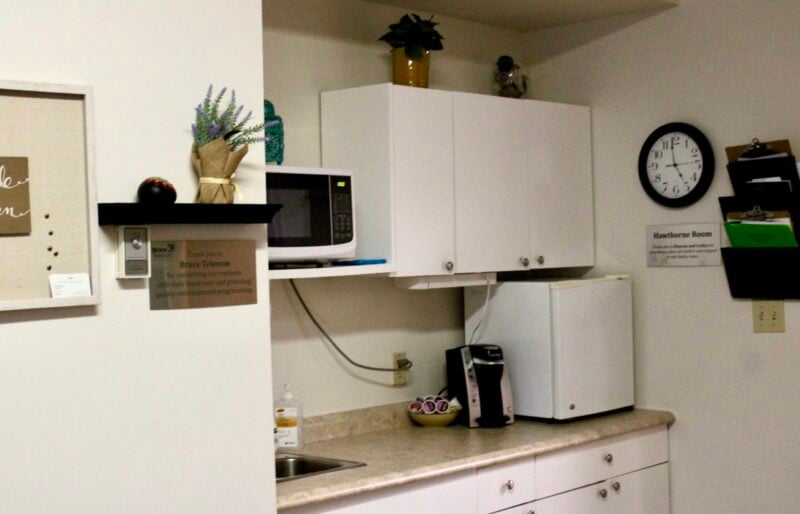 A kitchenette stocked with snacks and beverages