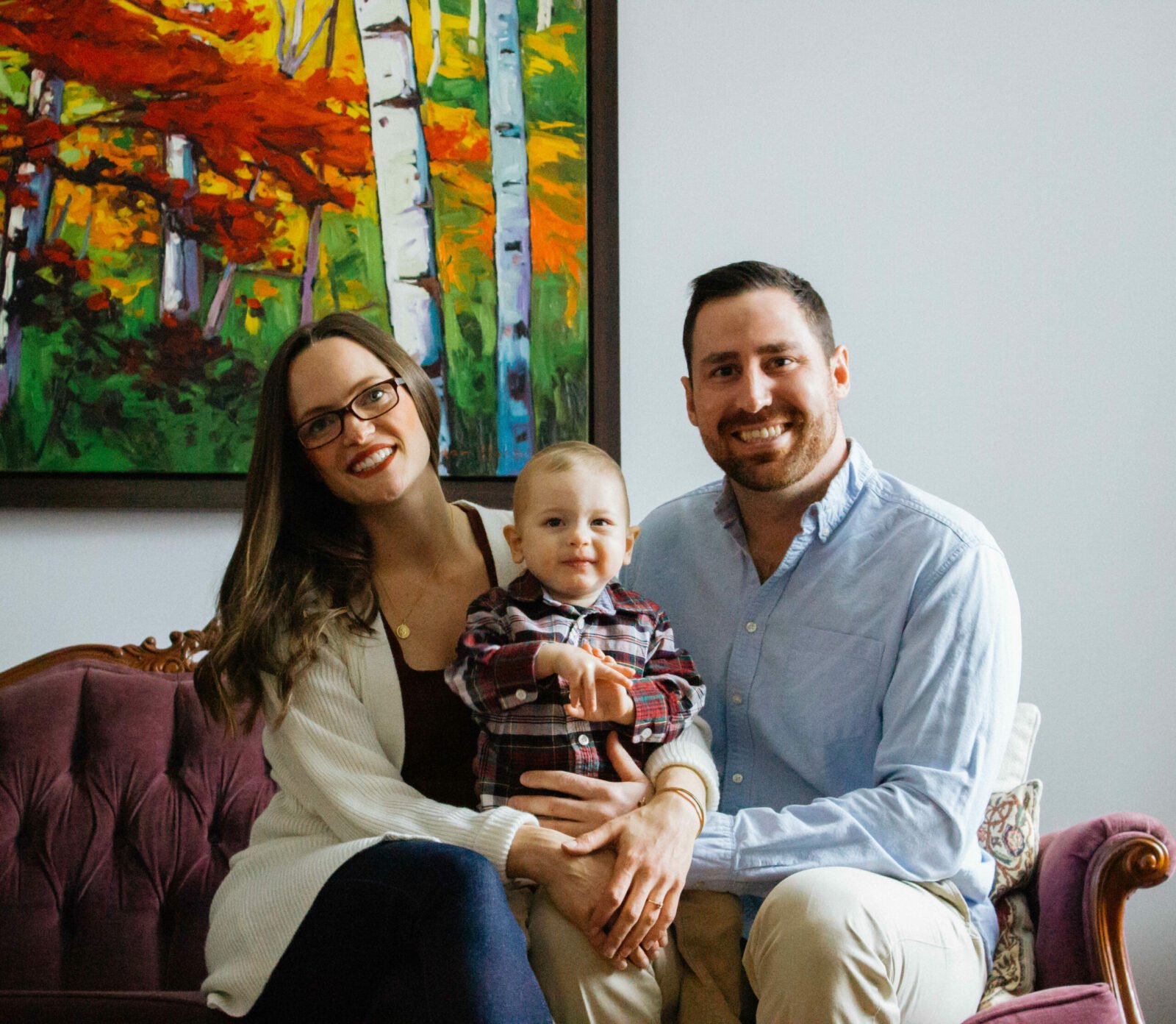 young blood recipient sits with his parents on either side