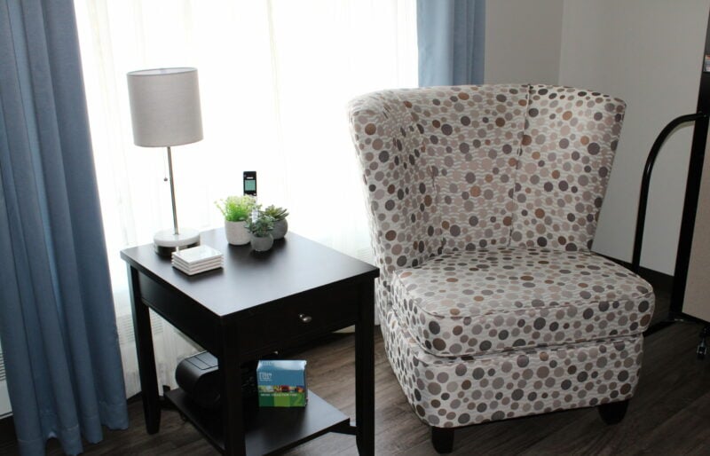 A chair with side table and reading light