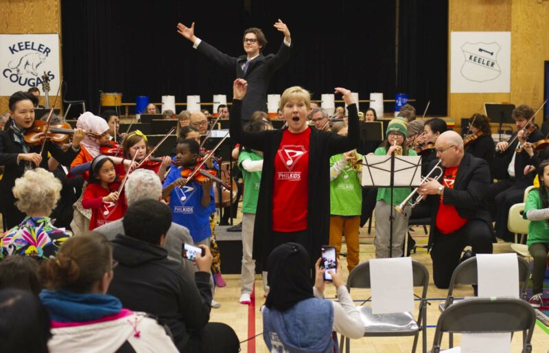 A group of children from PhilKids performs music for their families