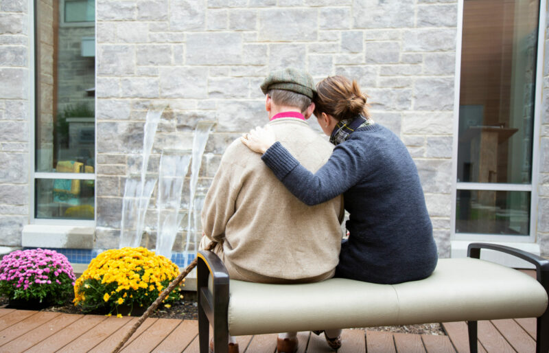 hugging family at hospice waterfall