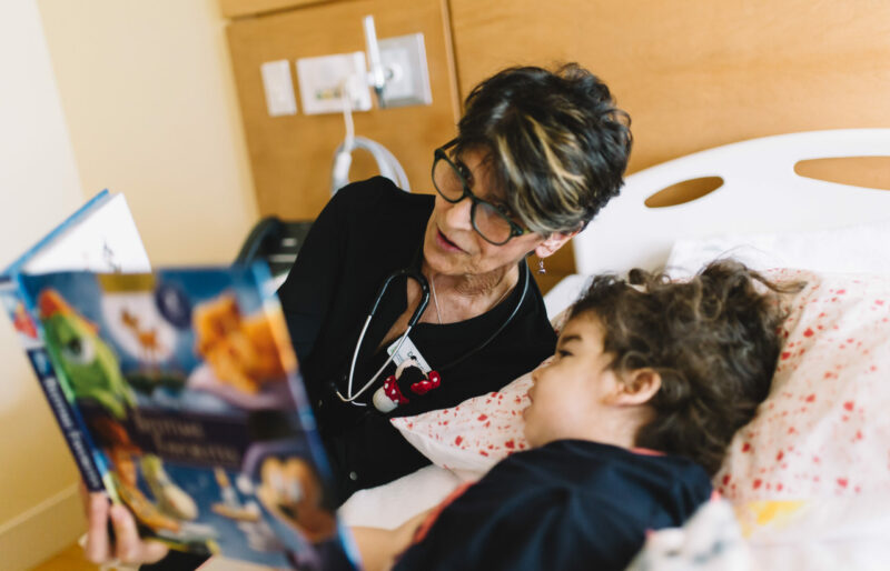 Nurse Doreen with a Canuck Place child