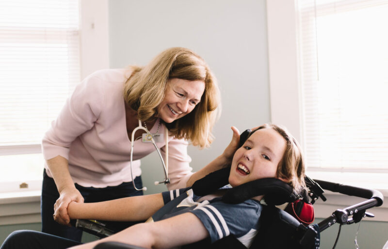 Nurse Brenda providing care to a Canuck Place child