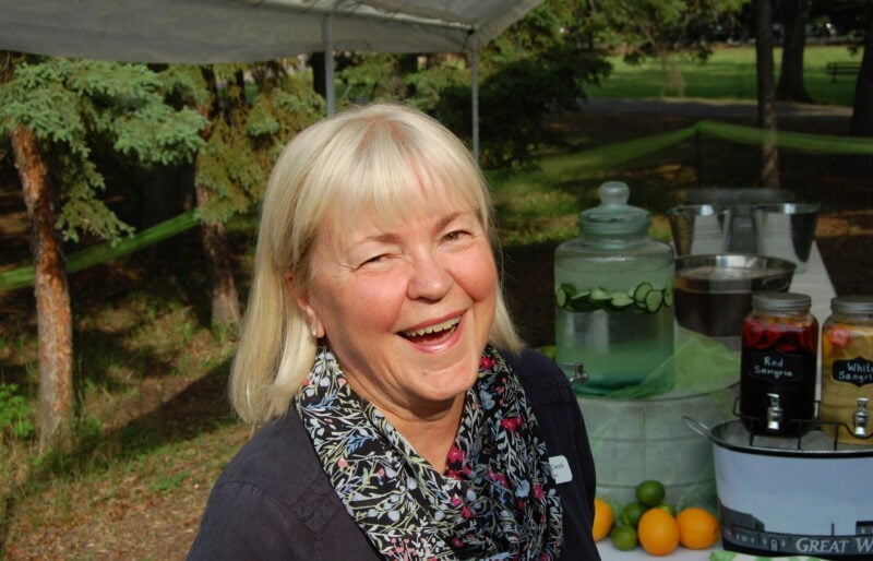 A women greets you at an event at Waskesiu Lake