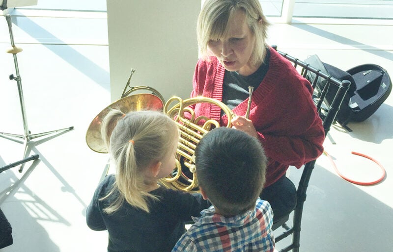 Children surround Horn Player at London Symphonia Cushion Concert at Museum London