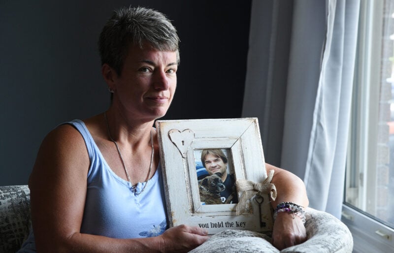 Women holding a picture of a lost loved one