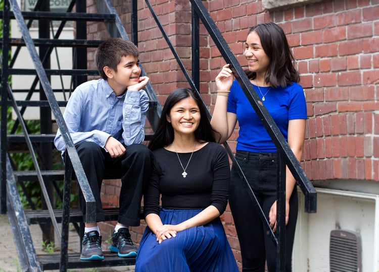 Siblings sitting on steps