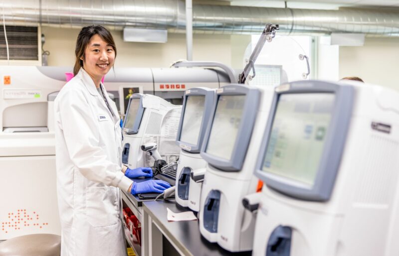 A health care worker completes tasks in the hospital's laboratory.