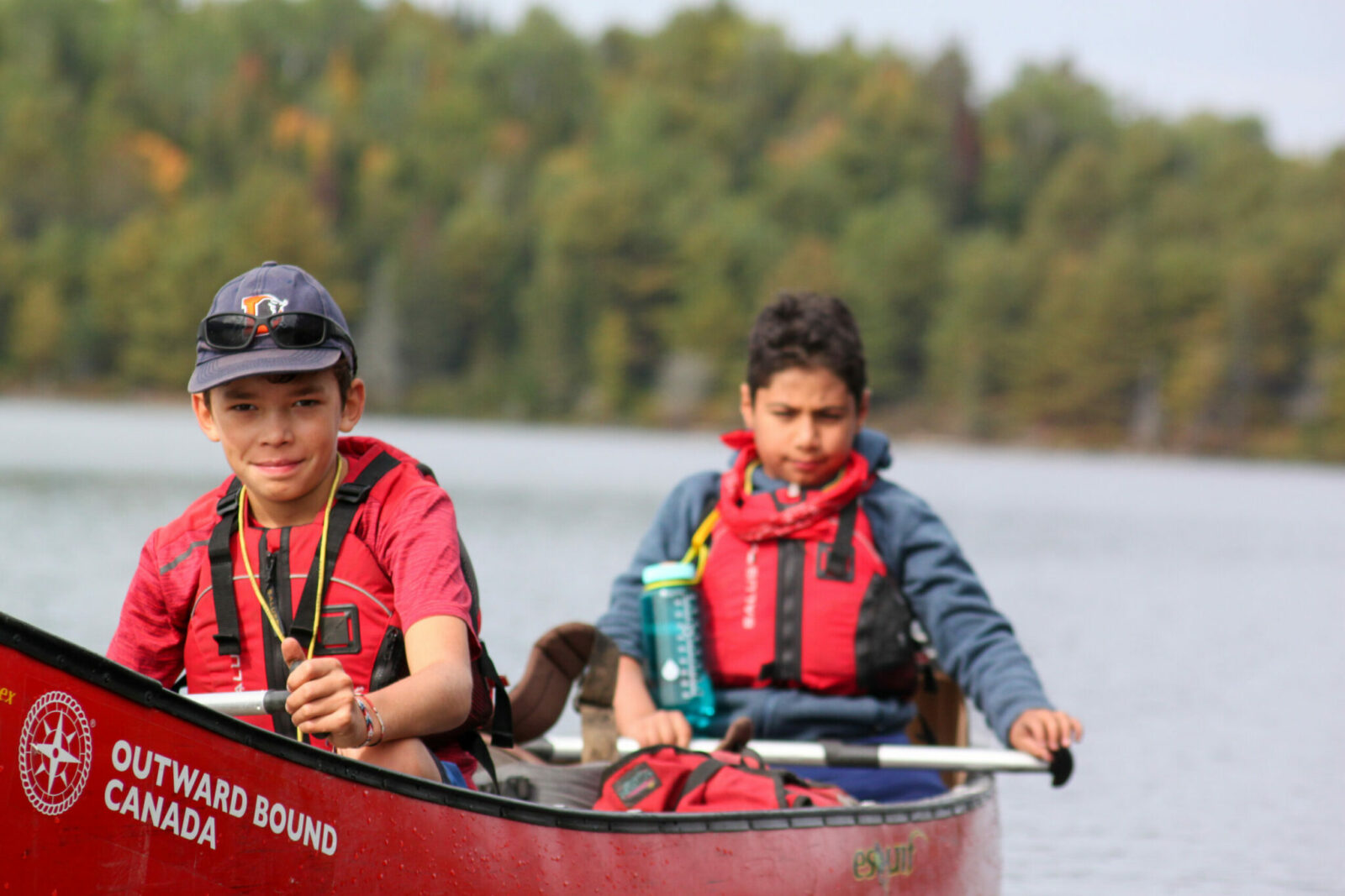Image of two kids in a canoe