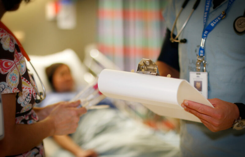 Nurse Checking Patient Chart