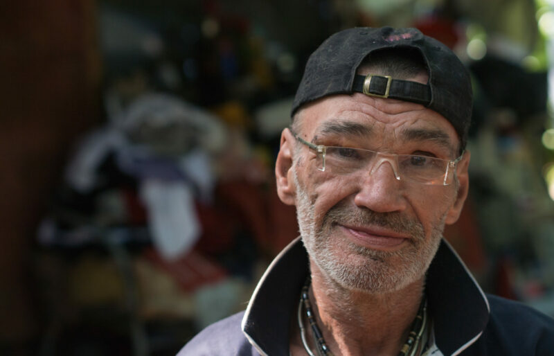 older man with HIV smiles for camera