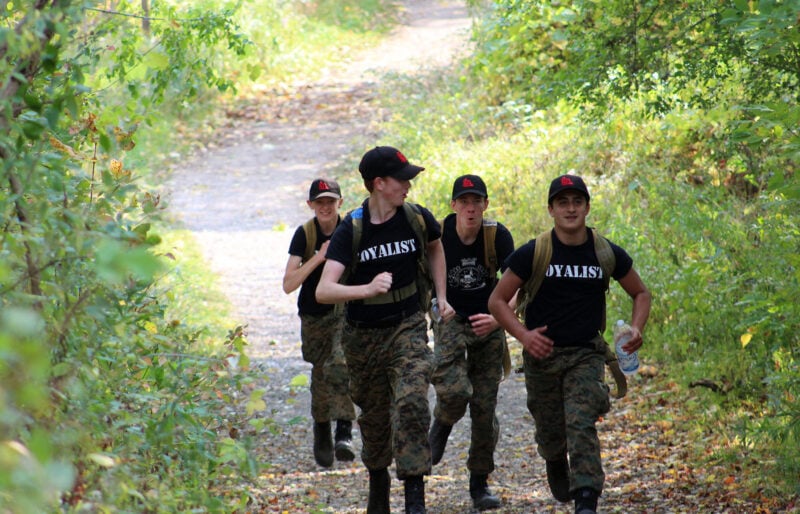 Boys jogging on a path.