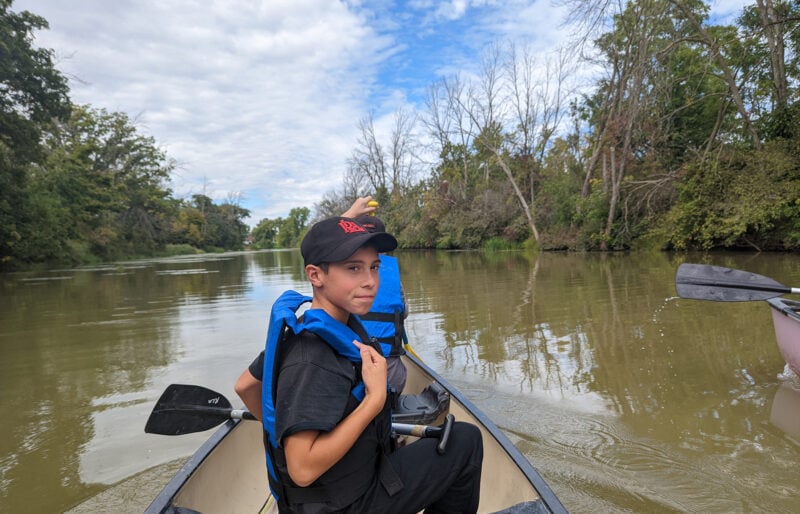 Boy in canoe.