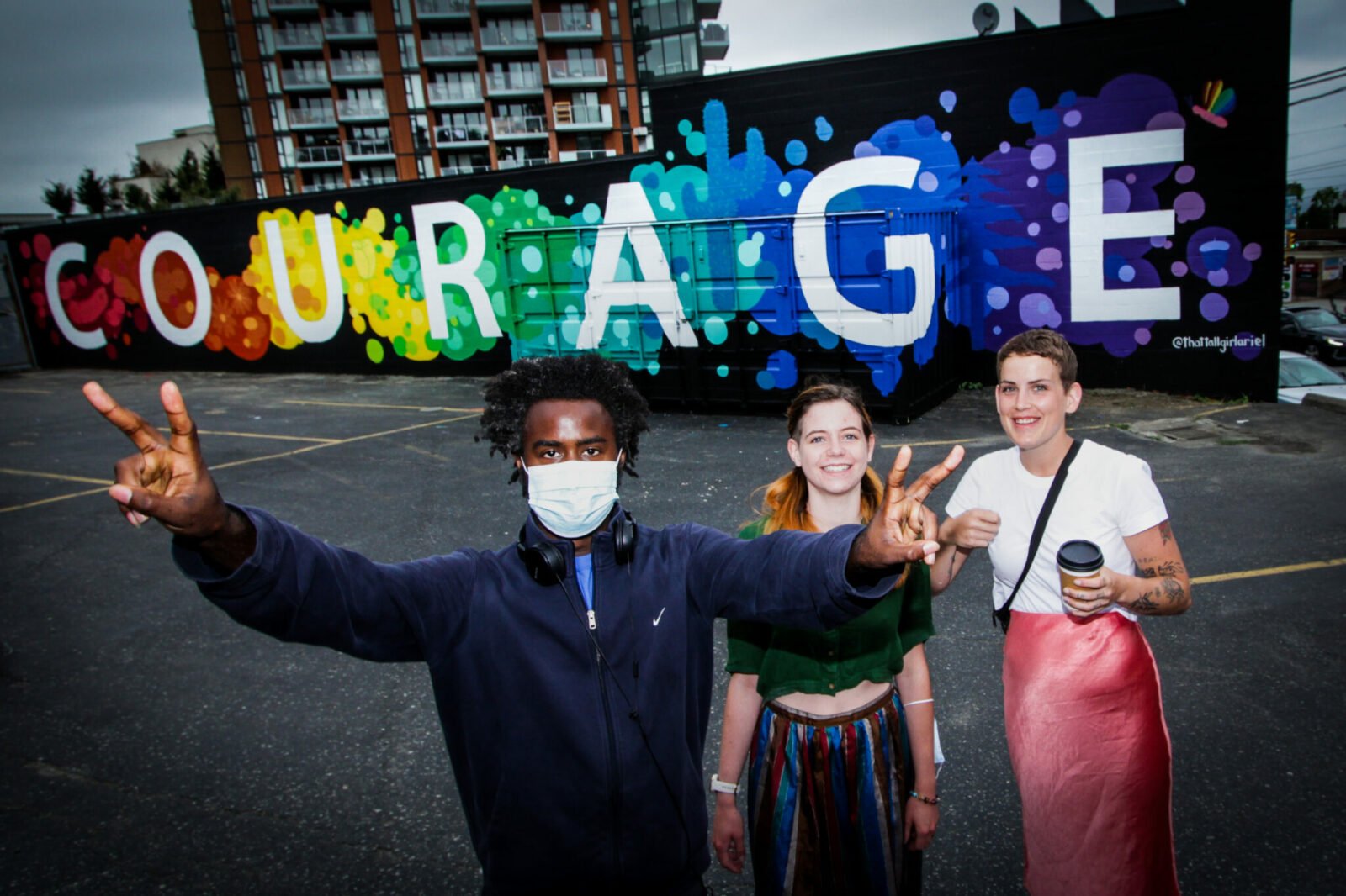 Young Adults at Coast Mental Health infront of their Courage mural