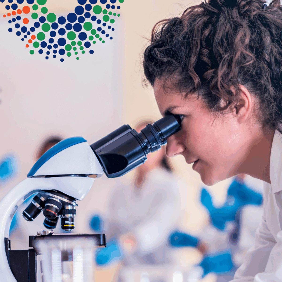 Scientist looking at microscope