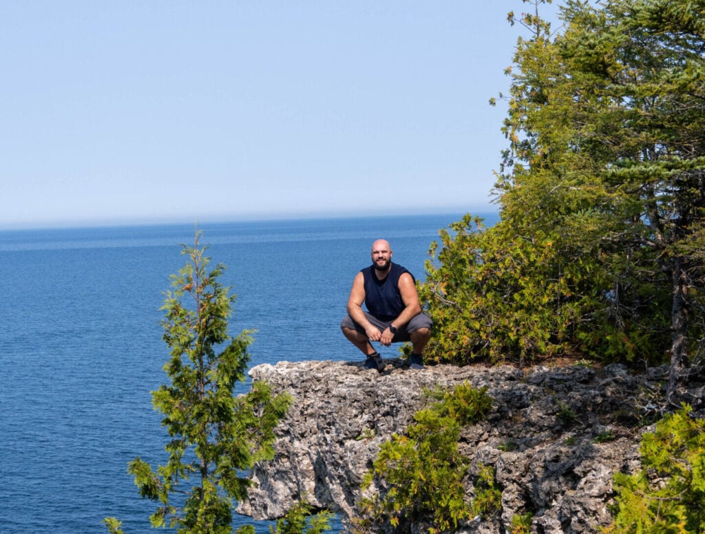 Dimitri on a fall hike at the Niagara Escarpment in Ontario, reconnecting with nature on the Bruce Peninsula.