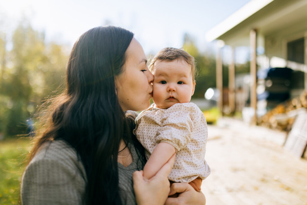 First Nations mother and child. Let the Seven Generations principle guide your giving.